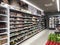 Supermarket aisle with shelfs full of a variety of products