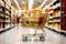 A supermarket cart with gold and red boxes of Christmas and New Year gifts between the supermarket\\\'s festive shelves. ,