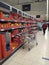 Supermarket interior with shelves full of various products, people at shopping. Bucharest, Romania, 2021