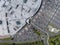 Supermarket roof and many cars in parking, viewed from above.