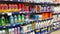 Supermarket shelves with cleaning products: detergents, disinfectants, soap, floor cleaners