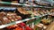 Supermarket shelves with plastic packed vegetables