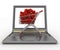 Supermarket trolley full of red hearts on laptop
