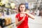 Supermarket worker making time out gesture