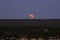 Supermoon Rising through Clouds over Flagstaff