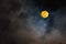 Supermoon in sky and clouds