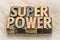 Superpower word abstract in wood type