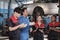 A supervisor engineer is training mechanic workers about car repair at a garage,