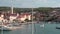 Supetar Croatia August 2020 Panning view of the port on the island of Brac, popular tourist destination. People still travelling
