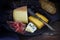 Supper plate with various cheese, air dried ham, blue grapes and