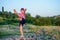 Supple young boy practicing pilates outdoors