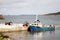 A supply boat unloading in the Scilly isles