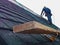 Support bracket and foot support on shingle roof installation