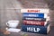 Support concept. Stack of books on wooden desk