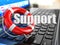 Support. Laptop and lifebuoy on laptop\'s keyboard.