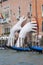 Support Sculpture by Lorenzo Quinn putting two giant hands protruding from the Grand Canal water, Venice, Italy
