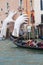 Support Sculpture by Lorenzo Quinn putting two giant hands protruding from the Grand Canal water, Venice, Italy