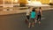 Supporting each others run. Rearview shot of a group of joggers running down an empty street at dawn.