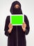 Supporting modern technology. Studio shot of a woman in a burqa using a digital tablet.