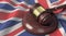 Supreme Court - Judge`s gavel lies on the UK flag