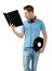 Suprised young deejay holding vinyl and learning