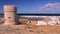 SUR, OMAN: General view of the beach of Ayjah with a watch tower in the foreground