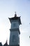 Surakarta, Indonesia - December 1, 2021: A towering white mosque tower as a place for loudspeakers