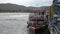 Suratthani, Thailand - August 02, 2019 : Passenger boat that wobbly float with strong waves at Nathon Ferry Port.