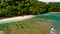 Surf coast on green bowl beach. Aerial view.