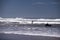 Surf fishing on Atlantic ocean coastline Adraga Beach