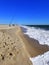 Surf fishing rods by waves near Dewey Beach, Delaware, U.S