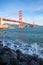 Surf in front of Golden Gate Bridge worldwide known symbol of California