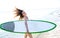 Surf girl with surfboard in beach shore