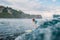 Surf girl on surfboard. Woman in ocean during surfing. Surfer and wave