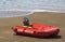 A surf rescue boat on the beach.