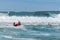 Surf rescue life savers and big waves at at Wanda Beach, NSW, Australia