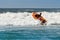 Surf rescue life savers boat jumping on the waves at Wanda Beach, NSW, Australia