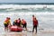 Surf rescue life savers training in progress. Surf rescue boat surrounded by the crew