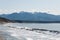 Surf waves at mountain background at Dungeness Spit, Olympic Peninsula, USA