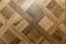 The surface of beautifully laid natural parquet. Decor, renovation and interior design. Close-up