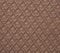 Surface of brown figured textile bedspread texture