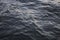 Surface of dark black water Sea wave Colored background. grunge dark black water texture useful as a background.