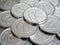 The surface of Japanese coins in one yen of aluminum. News about the economy, finance and banks of Japan. Deposits and loans to