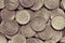 Surface of many Russian coins of 10 ten rubles. Burgundy yellow toned background or wallpaper. Backdrop on the theme of the