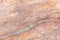 Surface of the marble with brown tint, stone texture and background. Imagination of the nature.