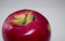 Surface mounted integrated circuit on a red apple.