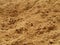 Surface of a pile of brown sand