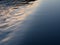 The surface of the river flowing through weir, close-up