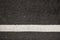 Surface rough of asphalt, Grey with white line on grainy road, Texture Background, Top view.