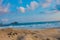 surface of sandy beach with blurry sea background as the horizon